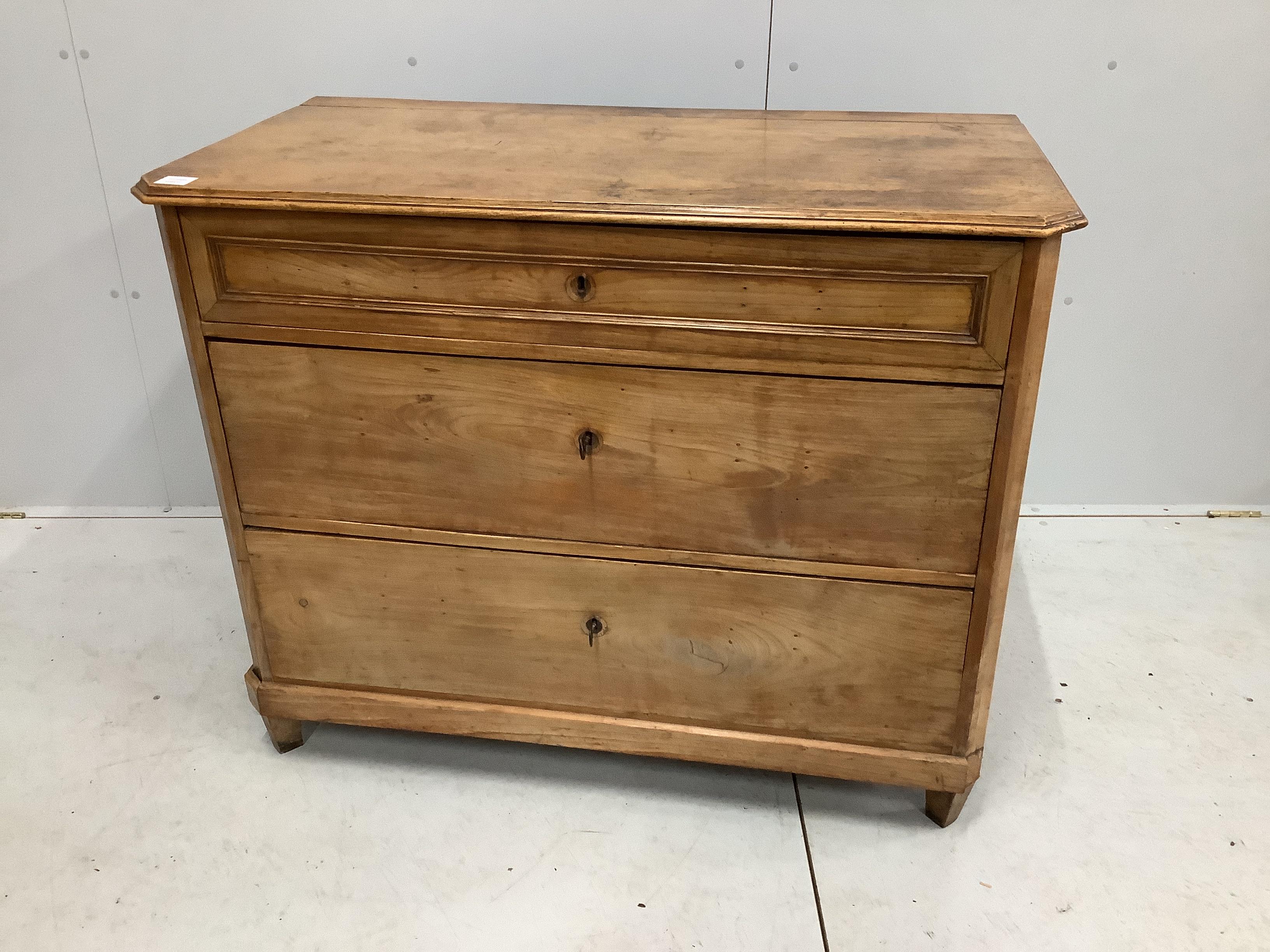 A 19th century Biedermeier maple three drawer commode (back foot loose), width 109cm, depth 57cm, height 88cm